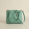 Camille leather clutch and crossbody bag in Hartland Aqua, handmade in Maine by Janell Bags